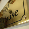 brass sign for exterior building